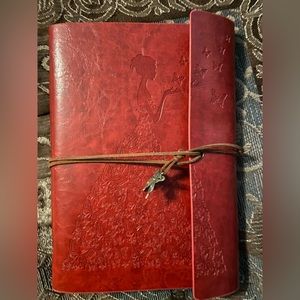 Leather look journal large, burgundy with beautiful lady embossed, NEW.